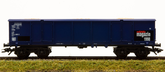 Märklin 46902 – Offener Güterwagen Eaos 106 der DB AG, mit Ladeguteinsatz Holzspäne 